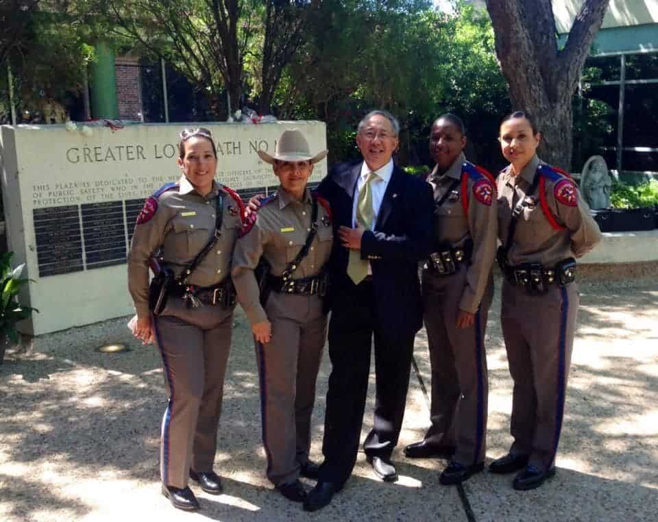 Erwin Ballarta the founder of Texas True Blue Coffee with four female Texas state troopers