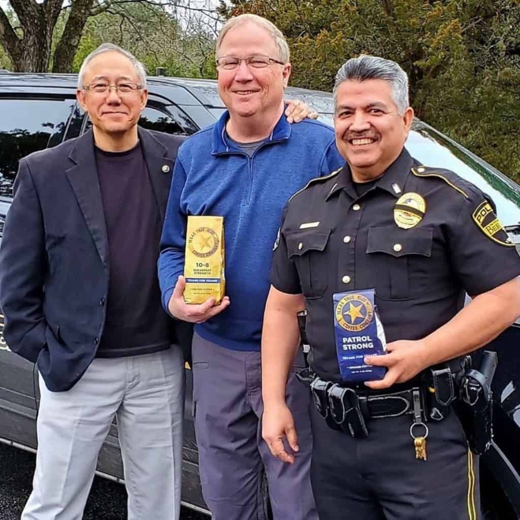 Erwin Ballarta with Texas officers showing off Texas True Blue Coffee 10-8 blend and patrol strong blend.