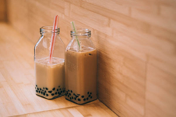 Two glasses of boba tea side by side.